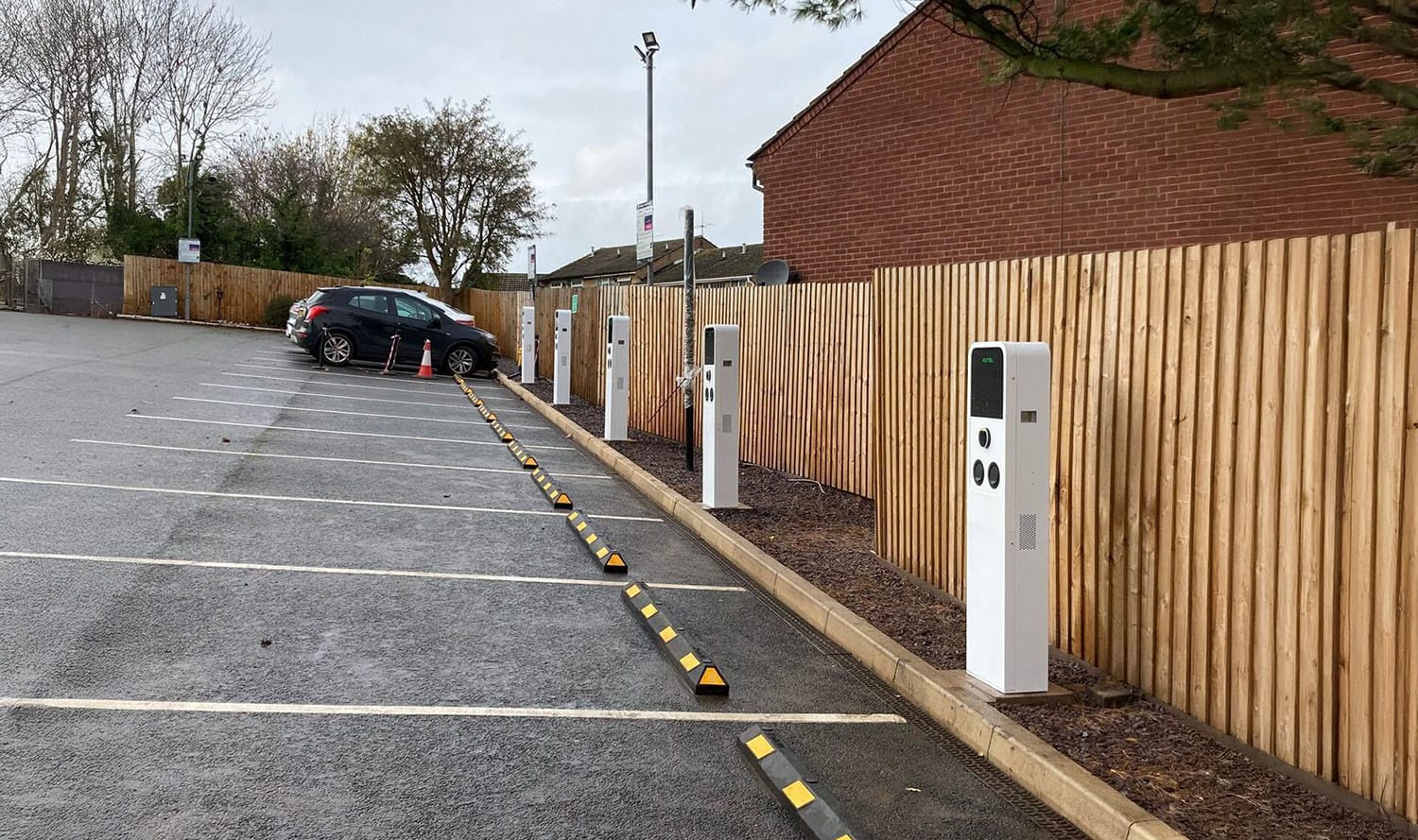 EV charging bays managed by a dynamic load management system at a commercial site