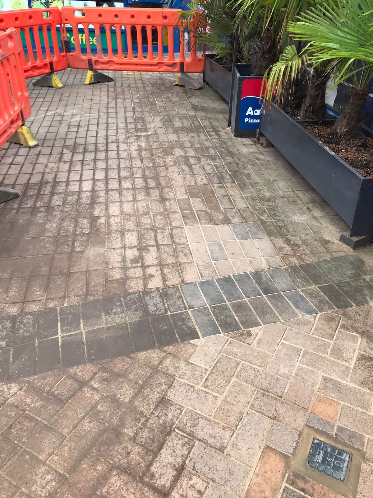 Completed block paving reinstatement showing colour-matched Marshalls Tegula blocks laid in 45 degree herringbone pattern with invisible joint line